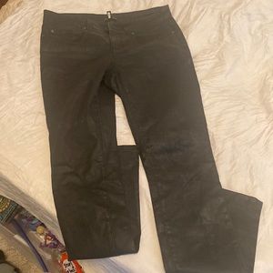 Size 6, black shiny Ellen Fisher pants somewheres which is normal for her age